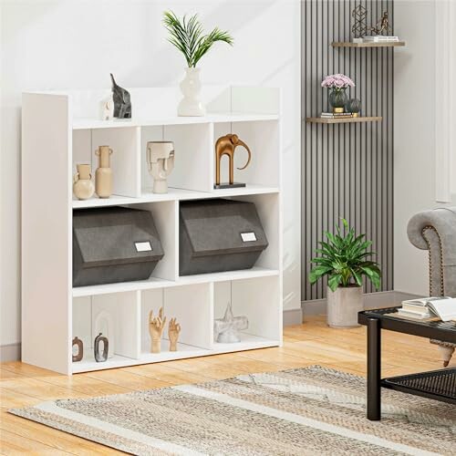 White bookshelf with decorative items and storage bins in a living room.