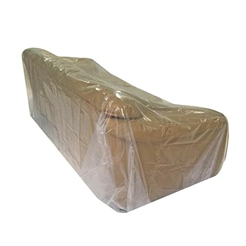 Sofa covered in a transparent plastic cover