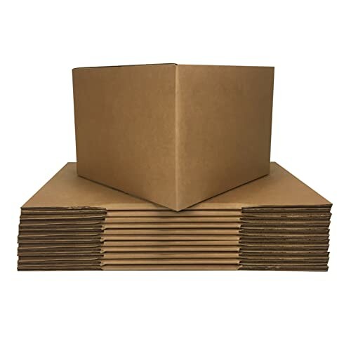 Stack of flat cardboard boxes with one assembled box on top.